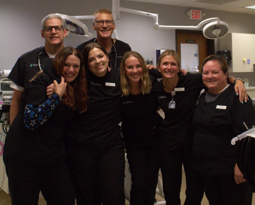 team photo in examination room of veterinary practice